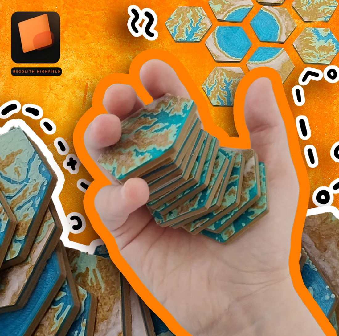 A hand holding 3D-printed hexagonal terrain map tiles for a board game